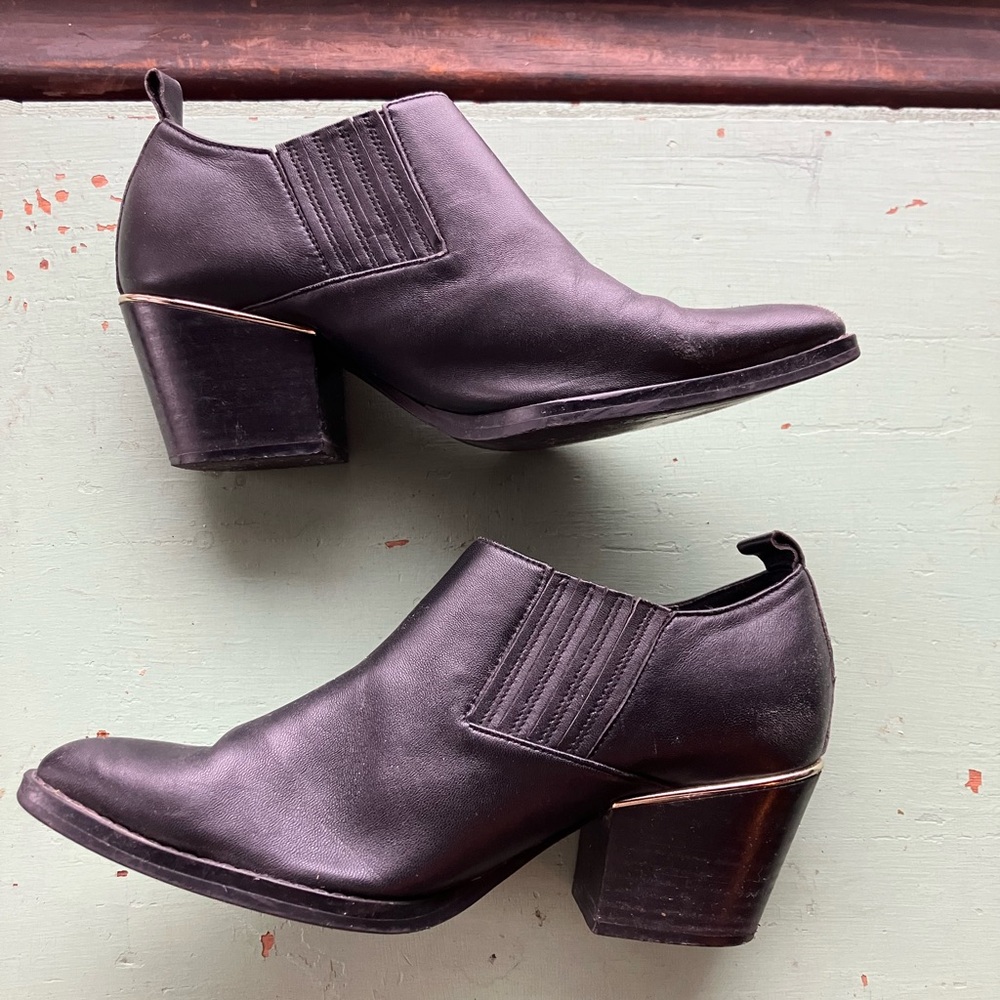 Pointy-Toe Black Ankle Booties with Silver Heel Detail